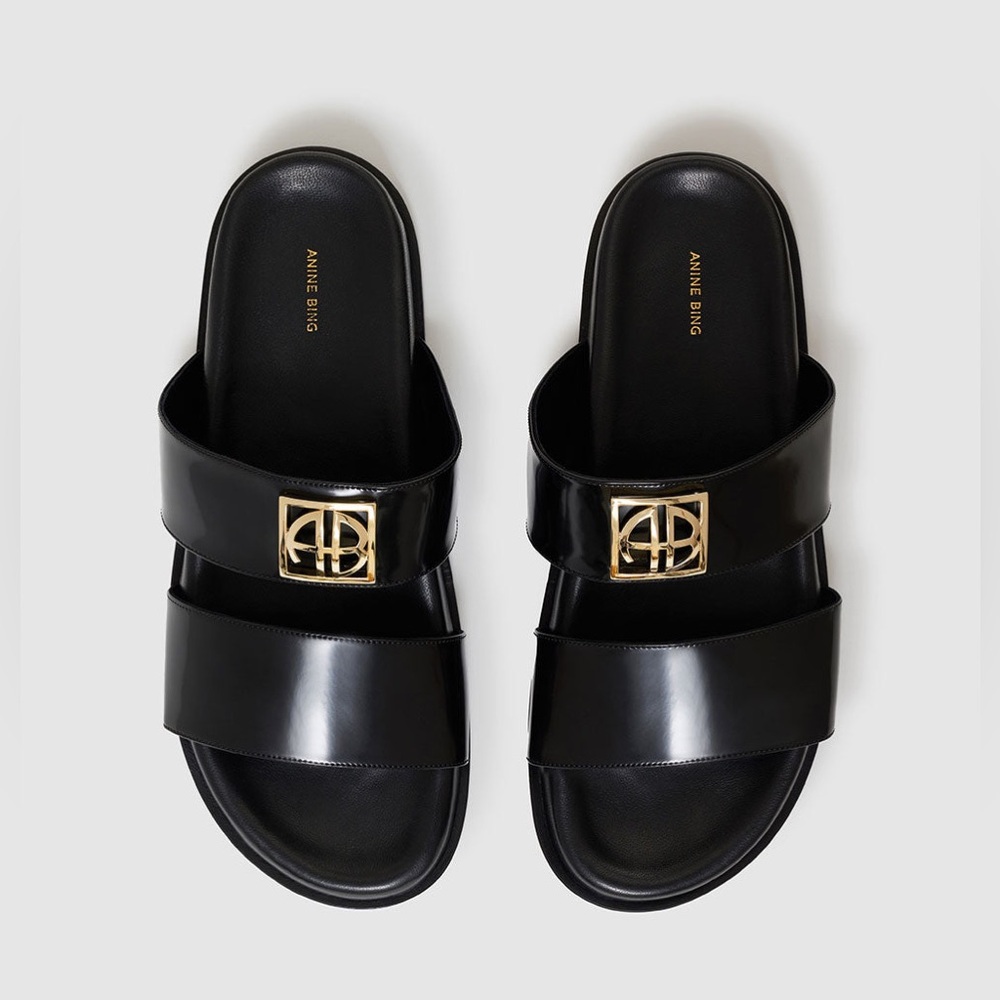 Anine Bing Parker monogramed leather shiny slides